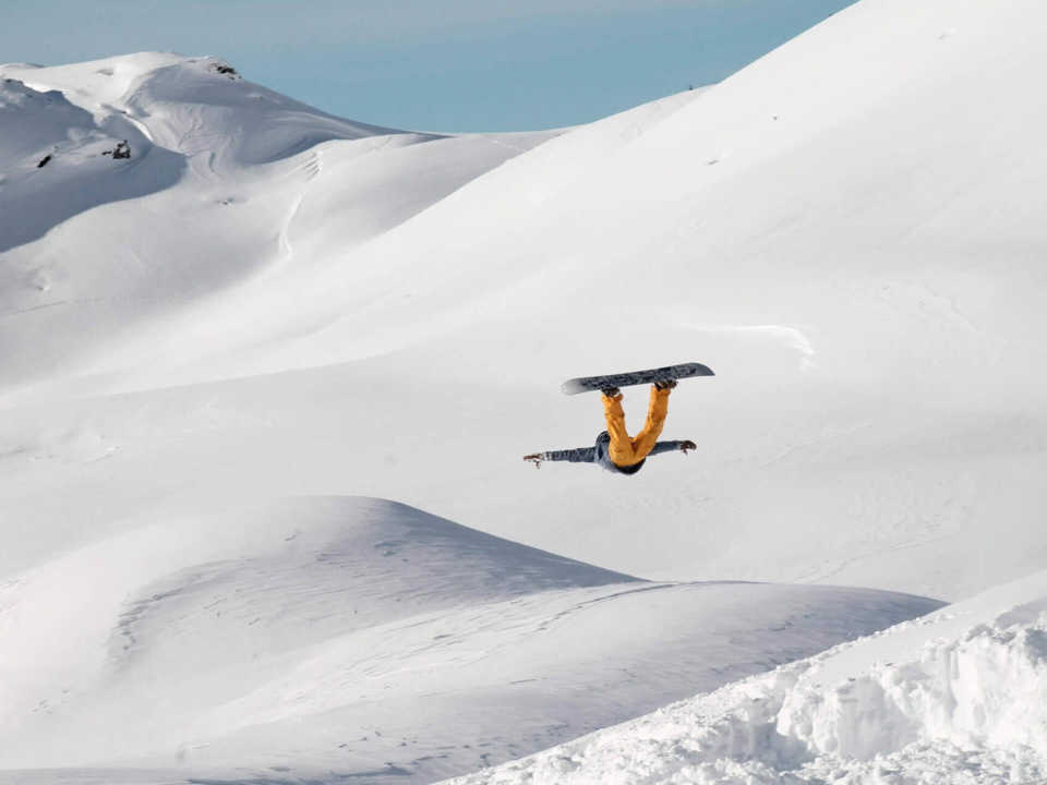 Snowboarder in mid-jump